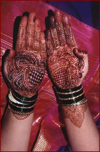 Indian wedding -  elaborate designs drawn on hands and feet